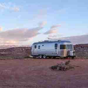 RV parked in the desert. Larger sized RVs should consider installing a tankless Suburban RV water heater.