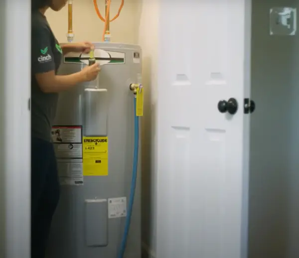 A water heater hidden in a closet.