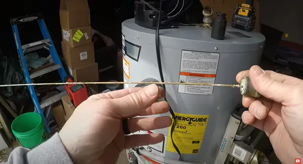 Old worn-out anode water heater rod. Replace the anode rod before it is completely consumed to prevent having to replace your water heater prematurely.