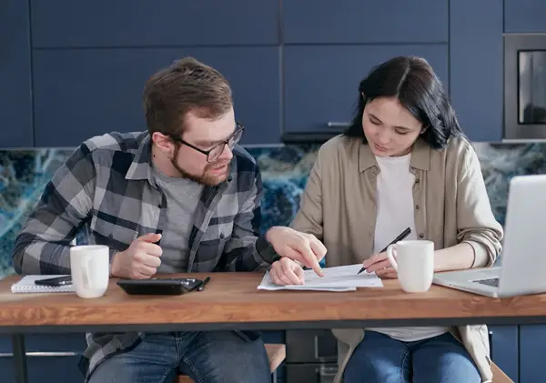Couple examining their energy bills.